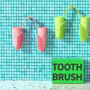 Pet Products Tooth Cleaning Finger Set in pink and green colors on a tiled wall with a 'TOOTH BRUSH' sign.